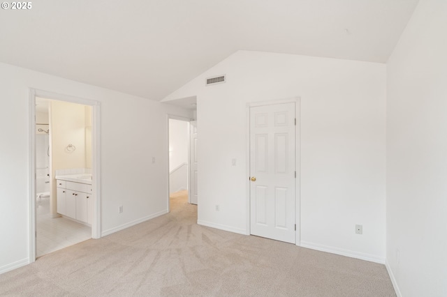 7408 SW Capitol Hwy, Portland, OR 97219 - unfurnished bedroom featuring light carpet, vaulted ceiling, and ensuite bathroom