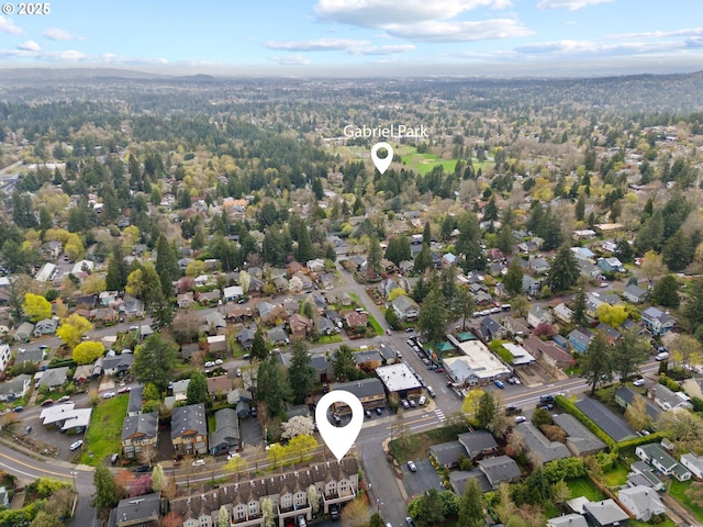 7408 SW Capitol Hwy, Portland, OR 97219 - aerial overview of property's location featuring nearby suburban area and a heavily wooded area