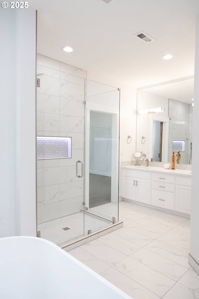 4604 NE 119th St, Vancouver, WA 98686 - full bath featuring vanity, a stall shower, visible vents, a freestanding bath, and marble finish floor