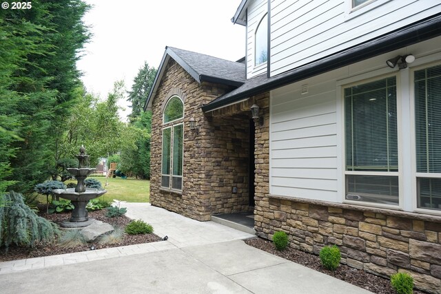 4604 NE 119th St, Vancouver, WA 98686 - view of side of home with roof with shingles and stone siding