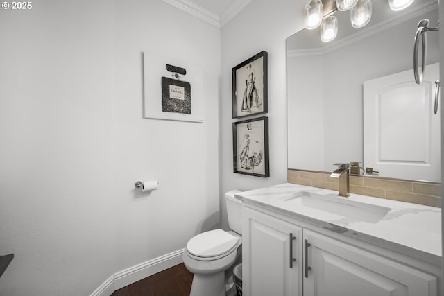 4604 NE 119th St, Vancouver, WA 98686 - bathroom featuring baseboards, toilet, crown molding, wood finished floors, and decorative backsplash