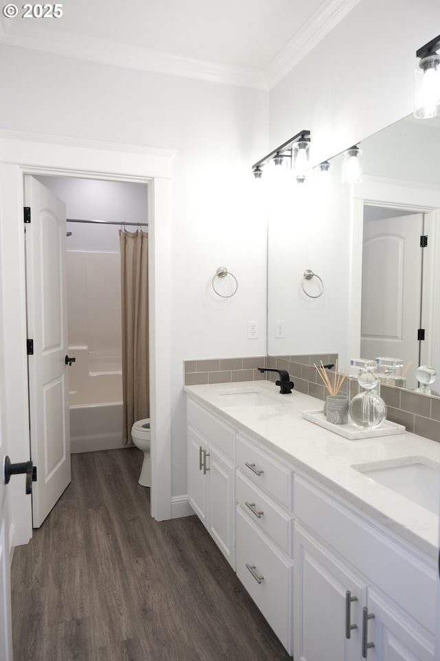 4604 NE 119th St, Vancouver, WA 98686 - bathroom with double vanity, crown molding, toilet, a sink, and wood finished floors