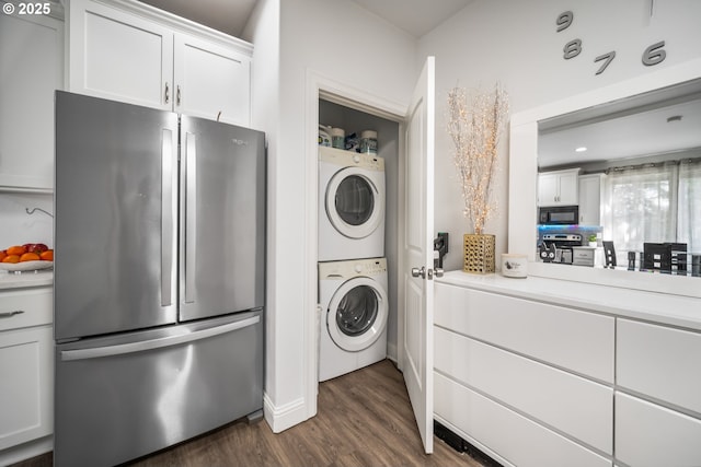 4604 NE 119th St, Vancouver, WA 98686 - washroom with dark wood finished floors, laundry area, and stacked washer and clothes dryer