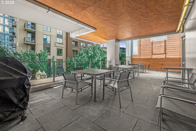view of patio / terrace featuring area for grilling and outdoor dining area