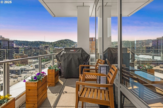balcony with a city view and grilling area