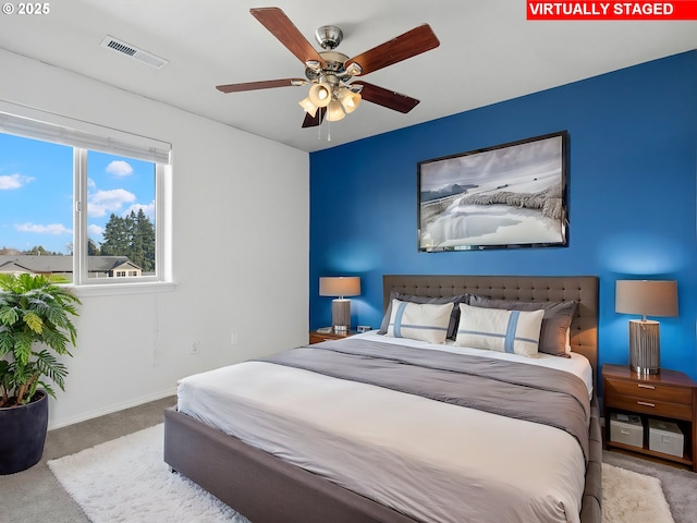 bedroom with light carpet and ceiling fan