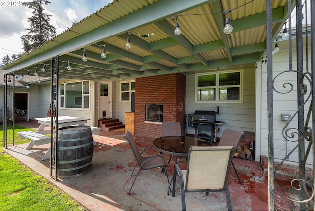 view of patio / terrace with entry steps, outdoor dining area, and area for grilling