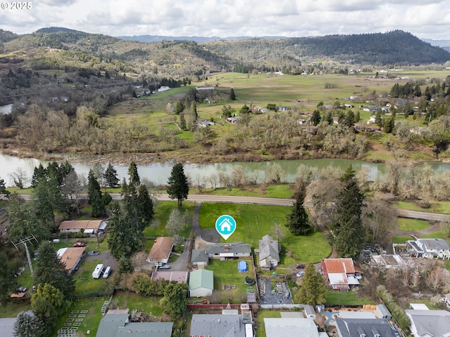 aerial view featuring a water and mountain view