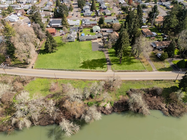 bird's eye view featuring a residential view and a water view