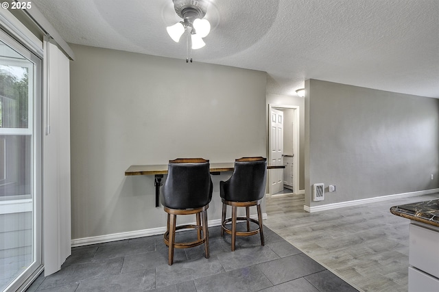 8396 SW Mohawk St, Tualatin, OR 97062 - dining room featuring ceiling fan and a textured ceiling