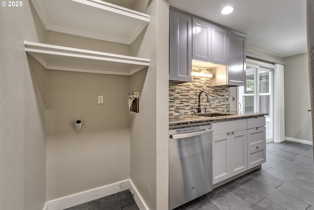 8396 SW Mohawk St, Tualatin, OR 97062 - kitchen featuring dishwasher, tasteful backsplash, and stone countertops