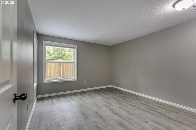 8396 SW Mohawk St, Tualatin, OR 97062 - unfurnished room featuring wood finished floors and a textured ceiling