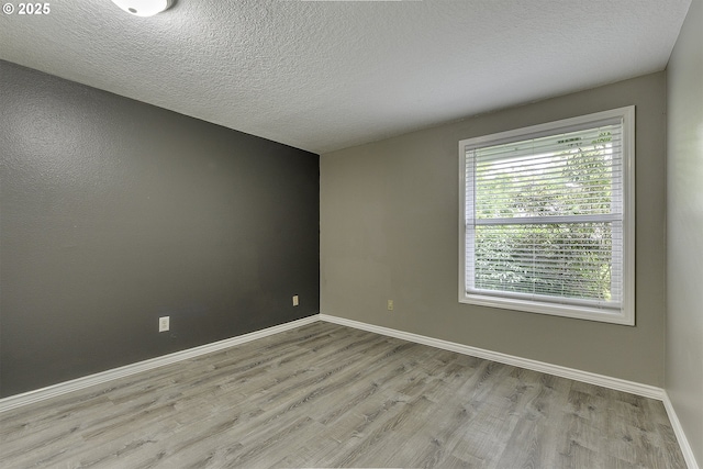 8396 SW Mohawk St, Tualatin, OR 97062 - empty room featuring wood finished floors and a textured ceiling