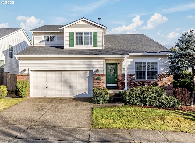 view of front of property with brick siding, concrete driveway, an attached garage, fence, and a front yard