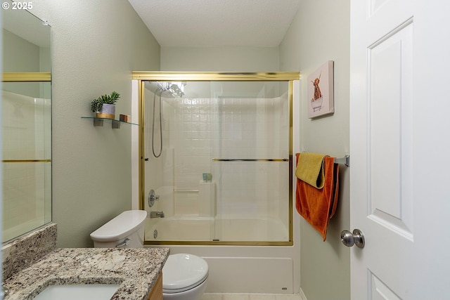 full bathroom featuring enclosed tub / shower combo, a textured ceiling, vanity, and toilet