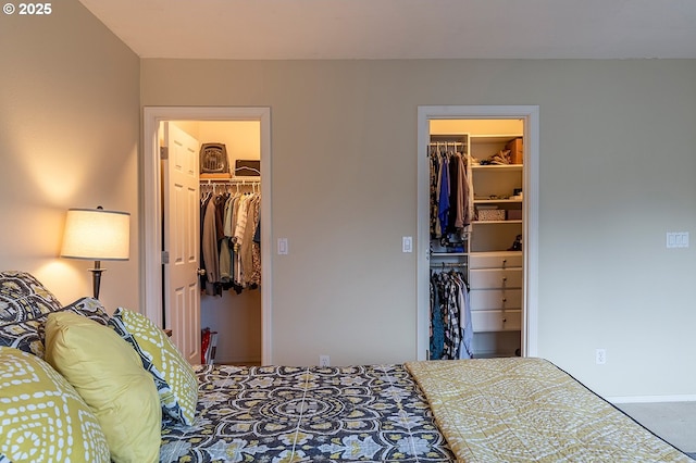 bedroom featuring a walk in closet and a closet