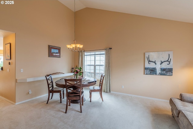 dining space featuring a notable chandelier, high vaulted ceiling, baseboards, and light colored carpet