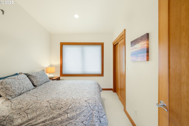 bedroom with light carpet, baseboards, and recessed lighting