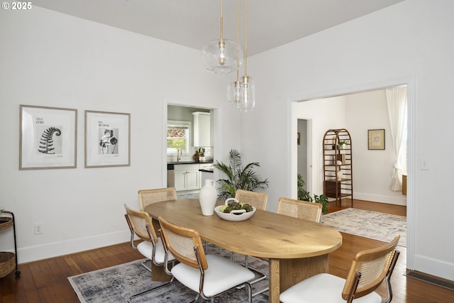 5106 N Bowdoin St, Portland, OR 97203 - dining area featuring dark wood-type flooring and baseboards