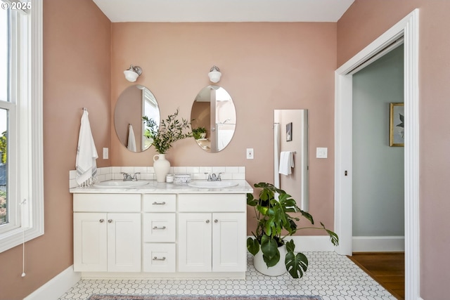 5106 N Bowdoin St, Portland, OR 97203 - bathroom with double vanity and baseboards