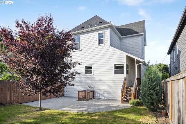 5106 N Bowdoin St, Portland, OR 97203 - rear view of house with a patio, fence, roof with shingles, and stairway