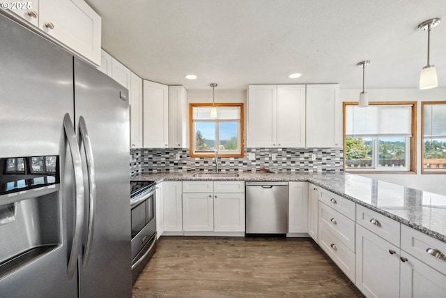 760 H St, Coos Bay, OR 97420 - kitchen featuring stainless steel appliances, a sink, white cabinets, and recessed lighting