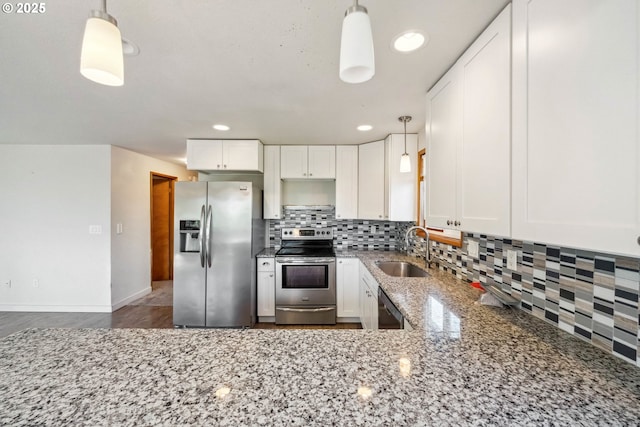 760 H St, Coos Bay, OR 97420 - kitchen with stainless steel appliances, a sink, tasteful backsplash, light stone counters, and white cabinetry