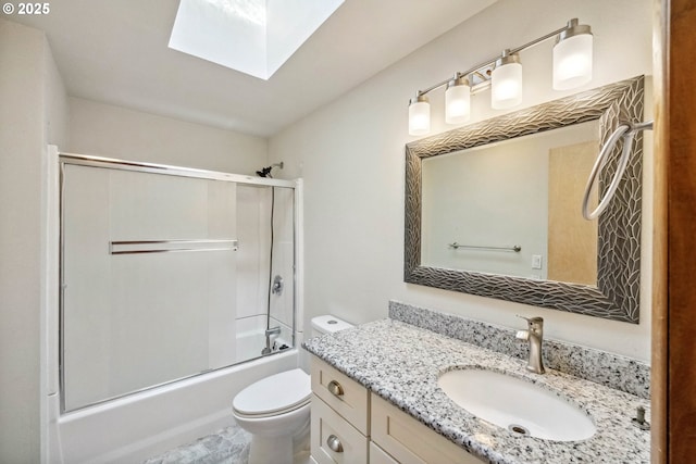 760 H St, Coos Bay, OR 97420 - bathroom featuring a skylight, vanity, toilet, and shower / bath combination with glass door