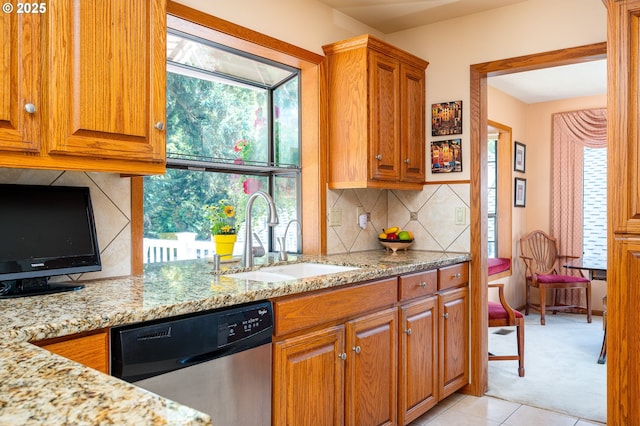 11560 SE 108th Ave, Happy Valley, OR 97086 - kitchen featuring dishwasher, light stone countertops, and plenty of natural light