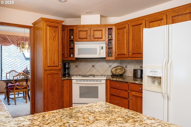 11560 SE 108th Ave, Happy Valley, OR 97086 - kitchen featuring white appliances, open shelves, backsplash, light stone counters, and brown cabinetry