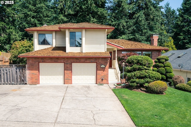 11560 SE 108th Ave, Happy Valley, OR 97086 - tri-level home featuring brick siding, an attached garage, concrete driveway, and a chimney