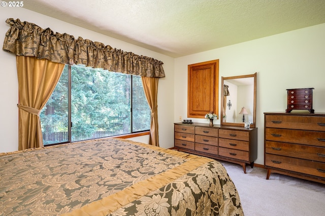 11560 SE 108th Ave, Happy Valley, OR 97086 - bedroom featuring light carpet and a textured ceiling