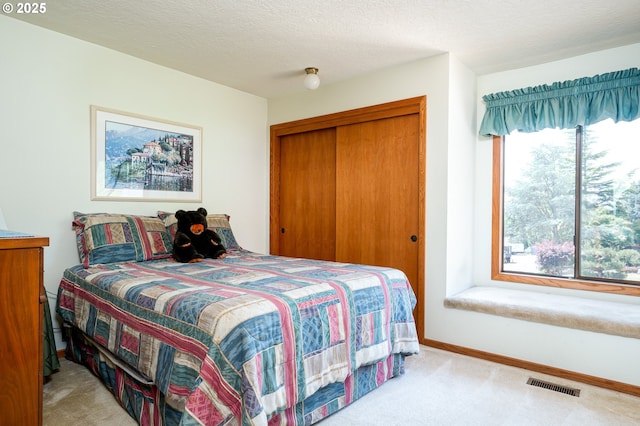 11560 SE 108th Ave, Happy Valley, OR 97086 - carpeted bedroom with a closet and a textured ceiling