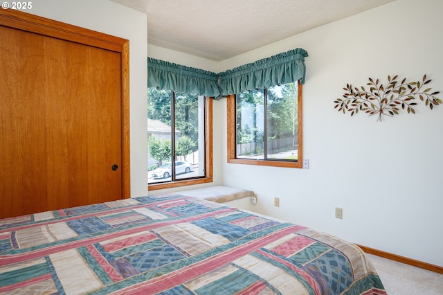 11560 SE 108th Ave, Happy Valley, OR 97086 - carpeted bedroom featuring a closet and a textured ceiling