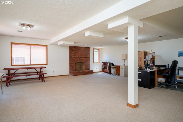11560 SE 108th Ave, Happy Valley, OR 97086 - below grade area featuring light colored carpet, a desk, a textured ceiling, and a brick fireplace