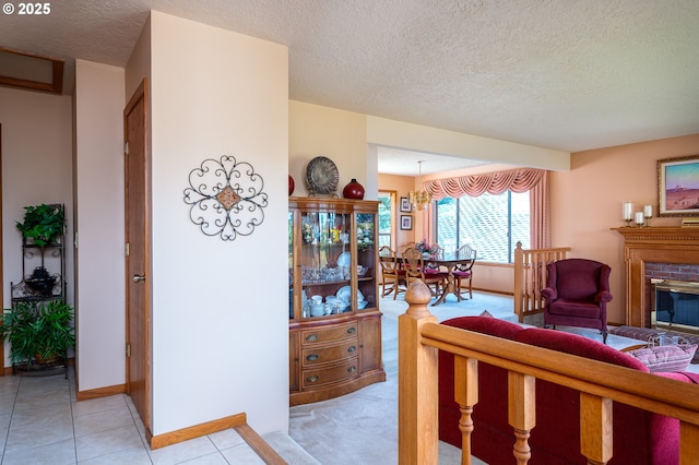 11560 SE 108th Ave, Happy Valley, OR 97086 - living area with a textured ceiling, a brick fireplace, and light tile patterned flooring