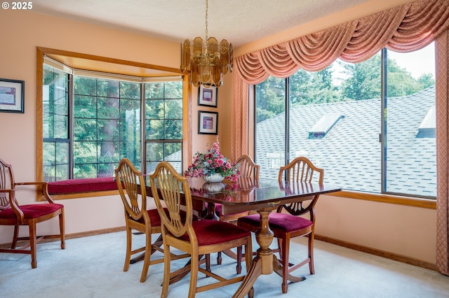 11560 SE 108th Ave, Happy Valley, OR 97086 - dining room featuring plenty of natural light, light colored carpet, a chandelier, and a textured ceiling