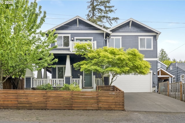 6706 SW 36th Ave, Portland, OR 97219 - craftsman-style home featuring a fenced front yard, an attached garage, and concrete driveway