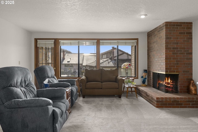 carpeted living room featuring a textured ceiling and a fireplace