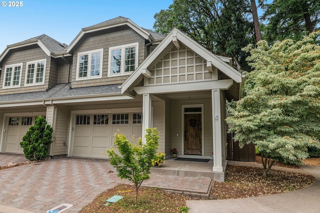 4661 Trillium, Woods, Lake Oswego, OR 97035 - view of front facade featuring a garage, decorative driveway, and a shingled roof
