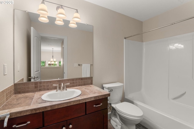 4661 Trillium, Woods, Lake Oswego, OR 97035 - bathroom featuring vanity, decorative backsplash, bathing tub / shower combination, and a chandelier