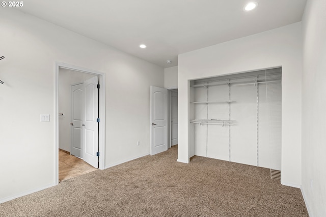 175 Truman Dr, Umatilla, OR 97882 - unfurnished bedroom with a closet, baseboards, recessed lighting, and carpet flooring