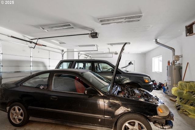 175 Truman Dr, Umatilla, OR 97882 - garage featuring a garage door opener and water heater