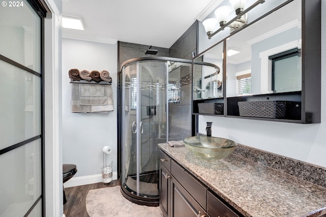 6836 NW Bony Rd, Yamhill, OR 97148 - bathroom featuring crown molding, a shower stall, wood finished floors, vanity, and baseboards