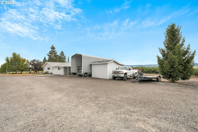 6836 NW Bony Rd, Yamhill, OR 97148 - view of side of home with a detached carport and driveway