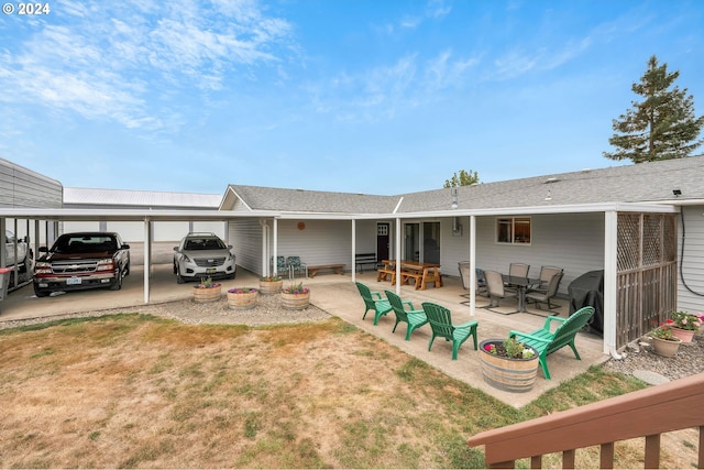 6836 NW Bony Rd, Yamhill, OR 97148 - back of house featuring a carport and a lawn