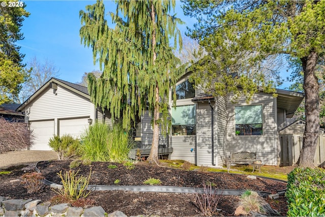 obstructed view of property featuring a garage