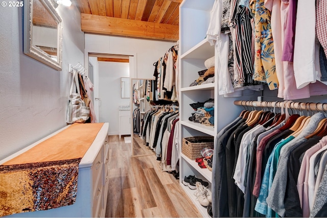 24492 SE Three Cedars St, Damascus, OR 97089 - walk in closet featuring light wood finished floors and beam ceiling