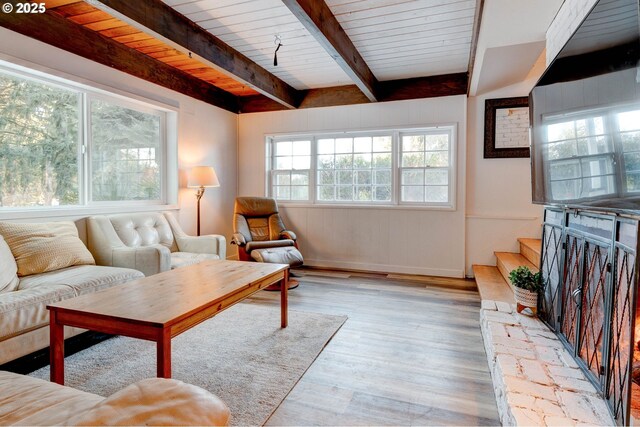 24492 SE Three Cedars St, Damascus, OR 97089 - living room featuring a wood ceiling with exposed beams, wood finished floors, and stairs