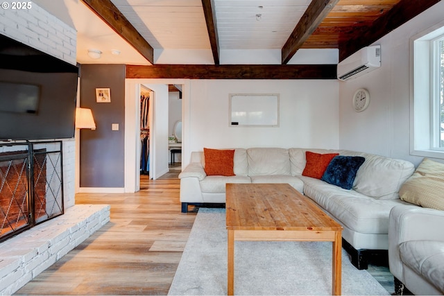 24492 SE Three Cedars St, Damascus, OR 97089 - living room with a wall mounted AC, light wood-type flooring, and a wooden ceiling with exposed beams